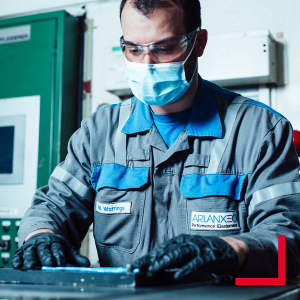 Working on a product with safety glasses Image